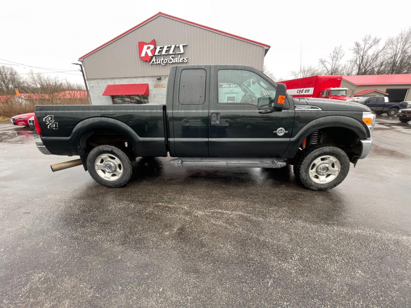 2015 Green /Gray Ford F-250 SD XLT SuperCab Long Bed 4WD (1FT7X2BT6FE) with an 6.7L V8 OHV 16V DIESEL engine, 6-Speed Automatic transmission, located at 547 E. Main St., Orwell, OH, 44076, (440) 437-5893, 41.535435, -80.847855 - Photo#7